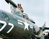 Asisbiz Grumman F9F 2P Panther PP77 Lt Zack Taylor gets ready for a reconnaissance flight off Korea Apr 1952 NH 97114