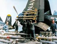 Asisbiz USS Philippine Sea (CV 47) Ordnancemen loading rockets Vought F4U 4B Corsair VF 64 off Korea on 11th Mar 1951 ASC1