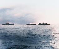 Asisbiz USS Birmingham (CL 62) at left and a destroyer pull away from USS Princeton (CVL 23) 24th Oct 1944 80 G 270553