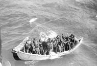 Asisbiz USS Princeton (CVL 23) survivors adrift in life boat at sea as seen from USS Cassin Young Oct 1944 80 G 281662