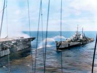 Asisbiz USS Reno (CL 96) alongside USS Princeton (CVL 23) during attempts to control her fires 24th Oct 1944 80 G 270430