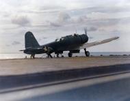 Asisbiz Propellor whirring, its tail hook still engaged, a plane comes to a stop after landing on USS Ranger CV 4 1943 80 G 035081