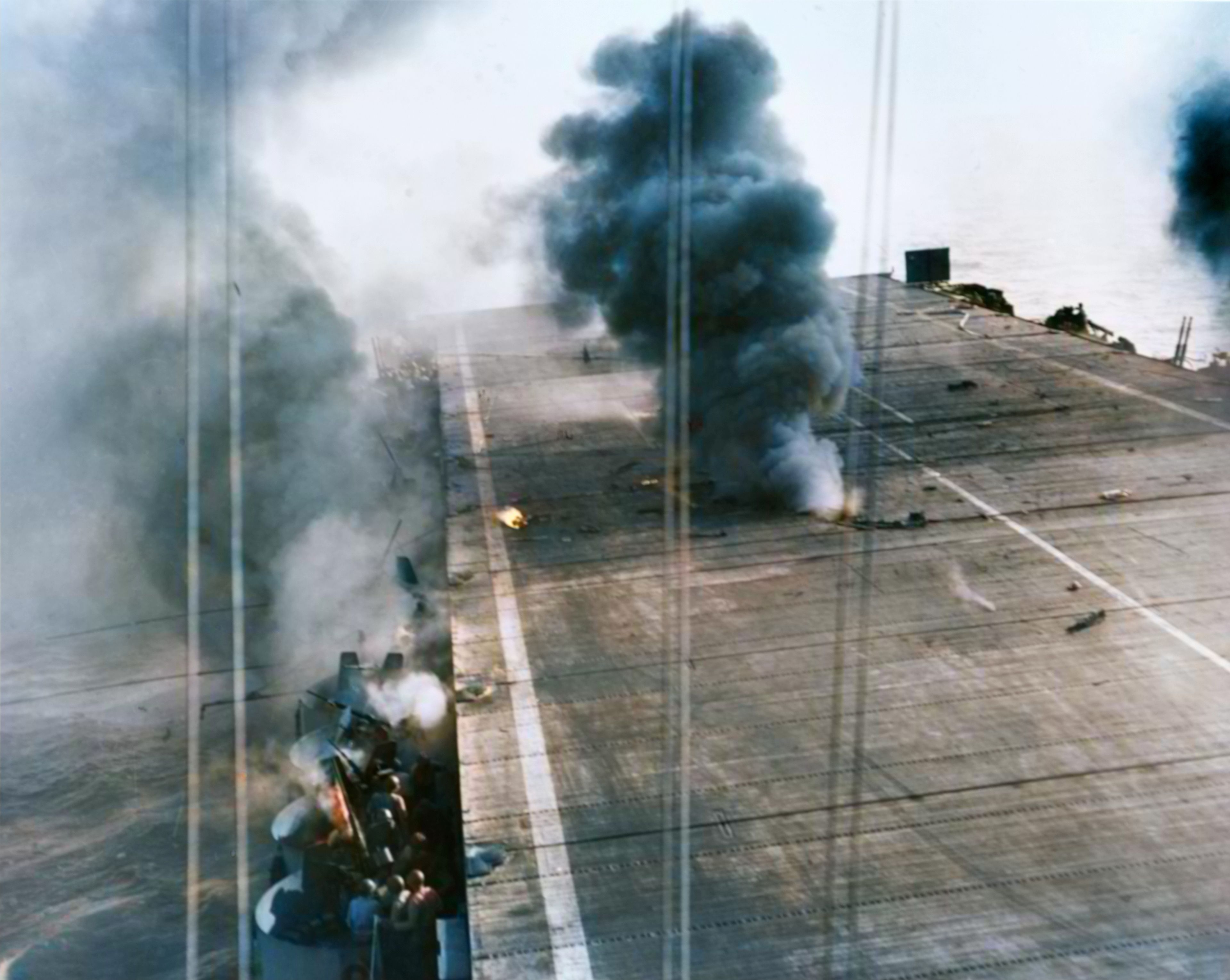 USS Suwannee (CVE 27) after a 250kg bomb hit the flight and hangar decks 25th Oct 1944 NH 71528