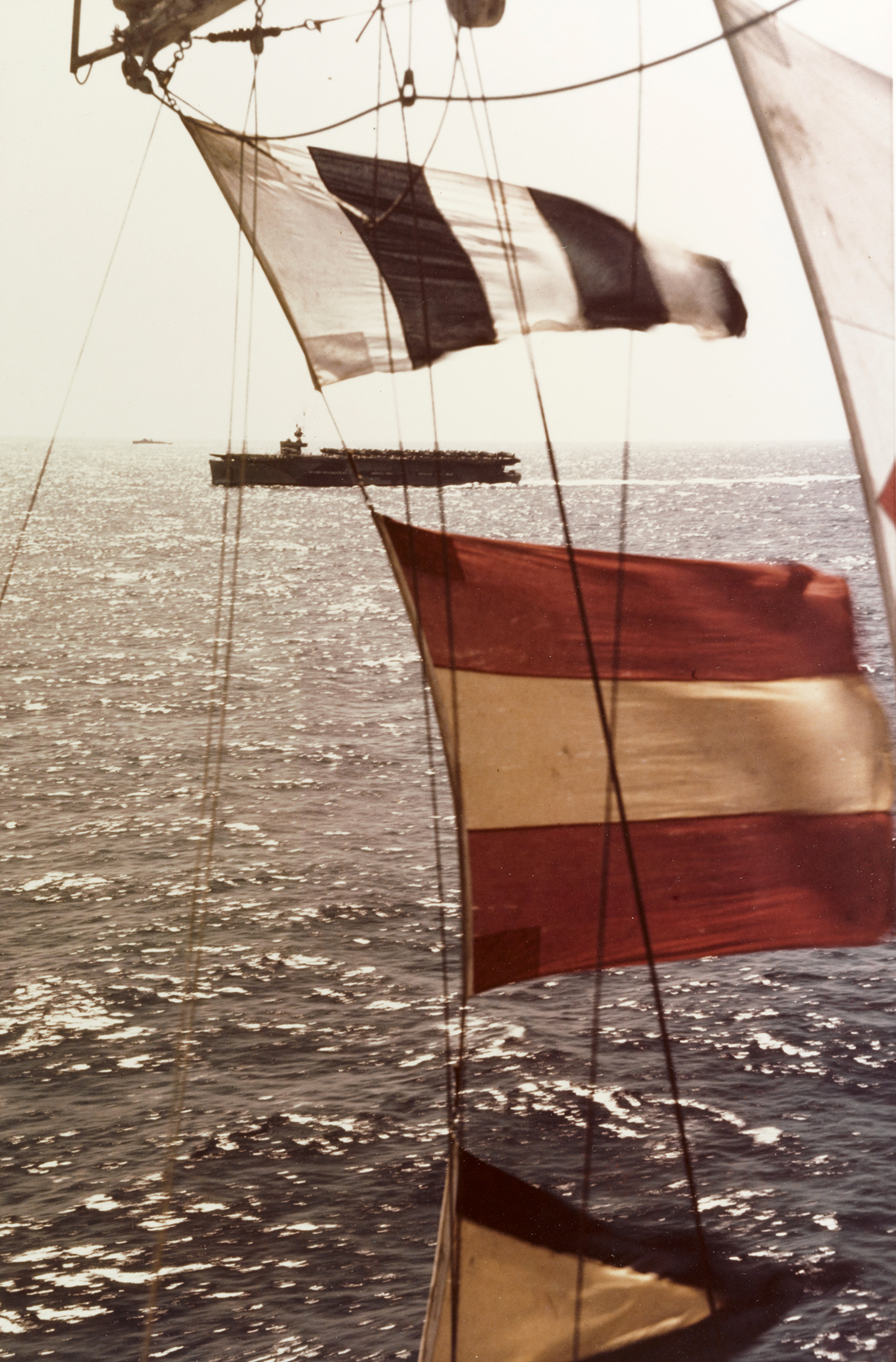 Asisbiz USS Kasaan Bay (CVE-69) seen through signal flags of USS Tulagi (CVE-72) off S France Operation Dragoon D Day 15th Aug 1944 80 G K 15369